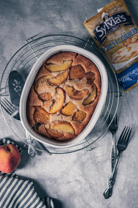 Finished cobbler served with ice cream, inviting family smiles.