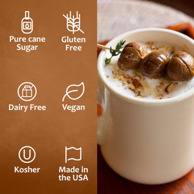 Syruvia Chestnut Praline syrup being poured into a cappuccino for aroma.