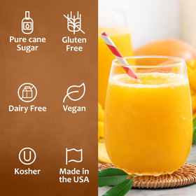 SYRUVIA Mango Syrup glass with drink showcases tropical aroma.