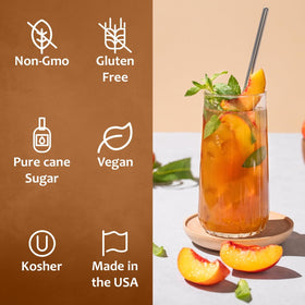 SYRUVIA Peach Syrup over ice in a dessert topping setup.