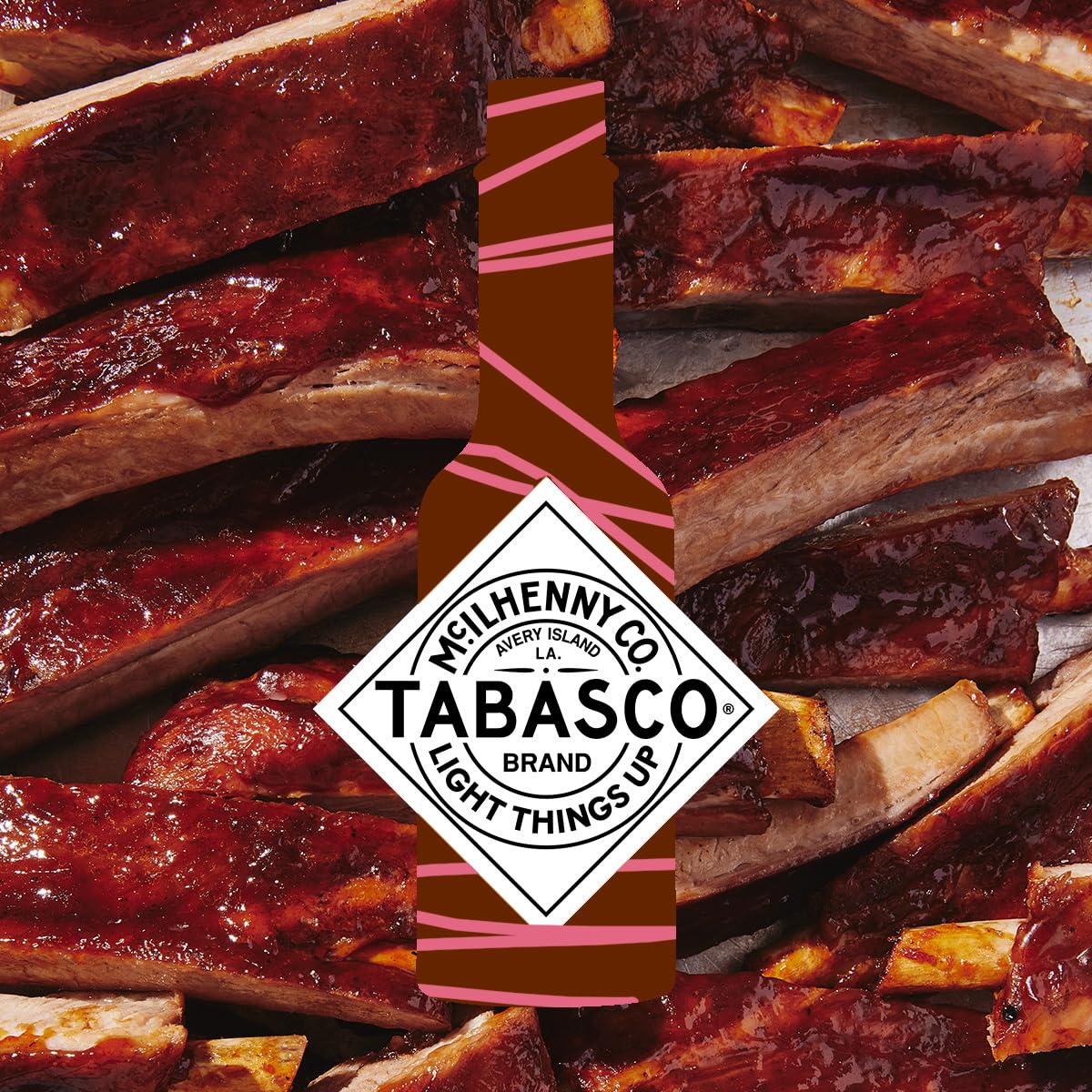 TABASCO Raspberry Chipotle bottle beside salad elevating dressing with sweet-smoky flair