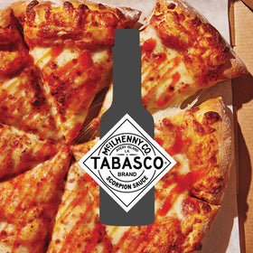 Close-up of TABASCO Scorpion Sauce label with certifications and heat hint.