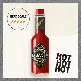 TABASCO Scorpion Sauce being poured, showcasing intense heat and glossy texture.