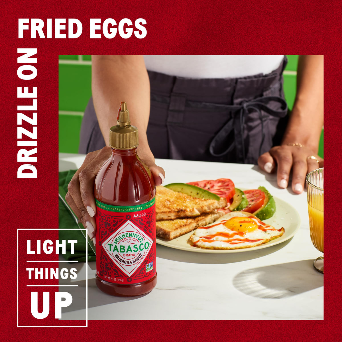 TABASCO Sriracha being dispensed into a dish for bold flavor