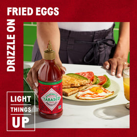 TABASCO Sriracha being dispensed into a dish for bold flavor