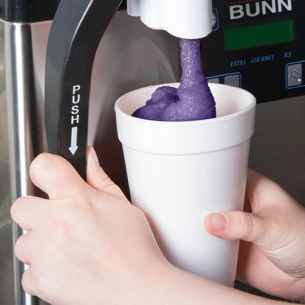 TableTop King grape slushy snow cone served at festival.