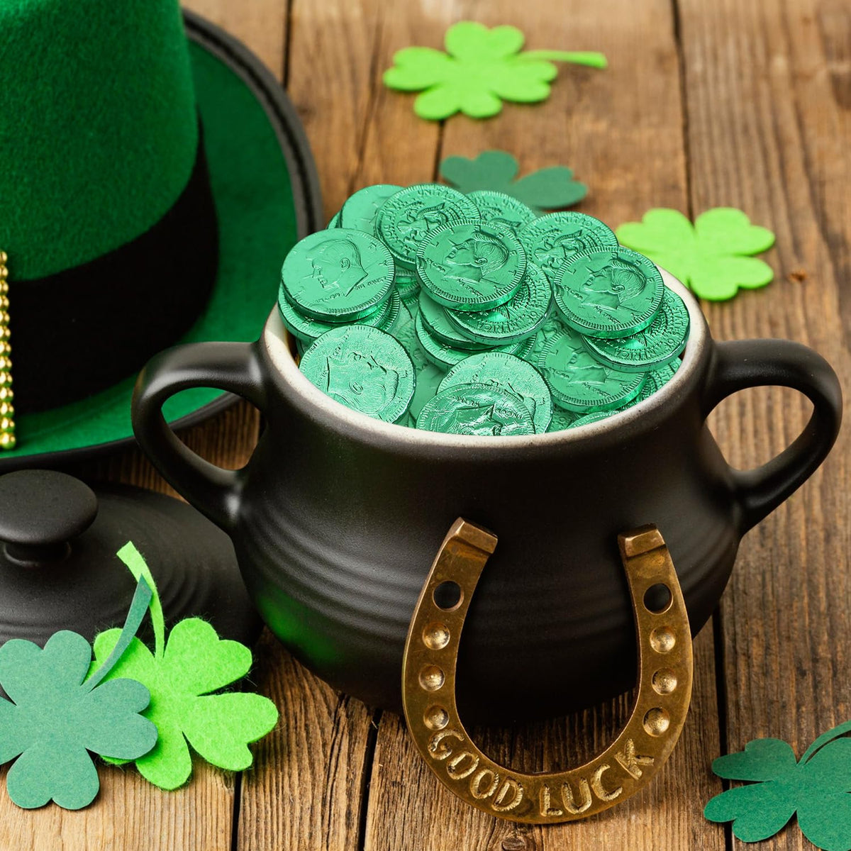 Closeup of Taboom coins in shiny green foil preserving freshness for events.