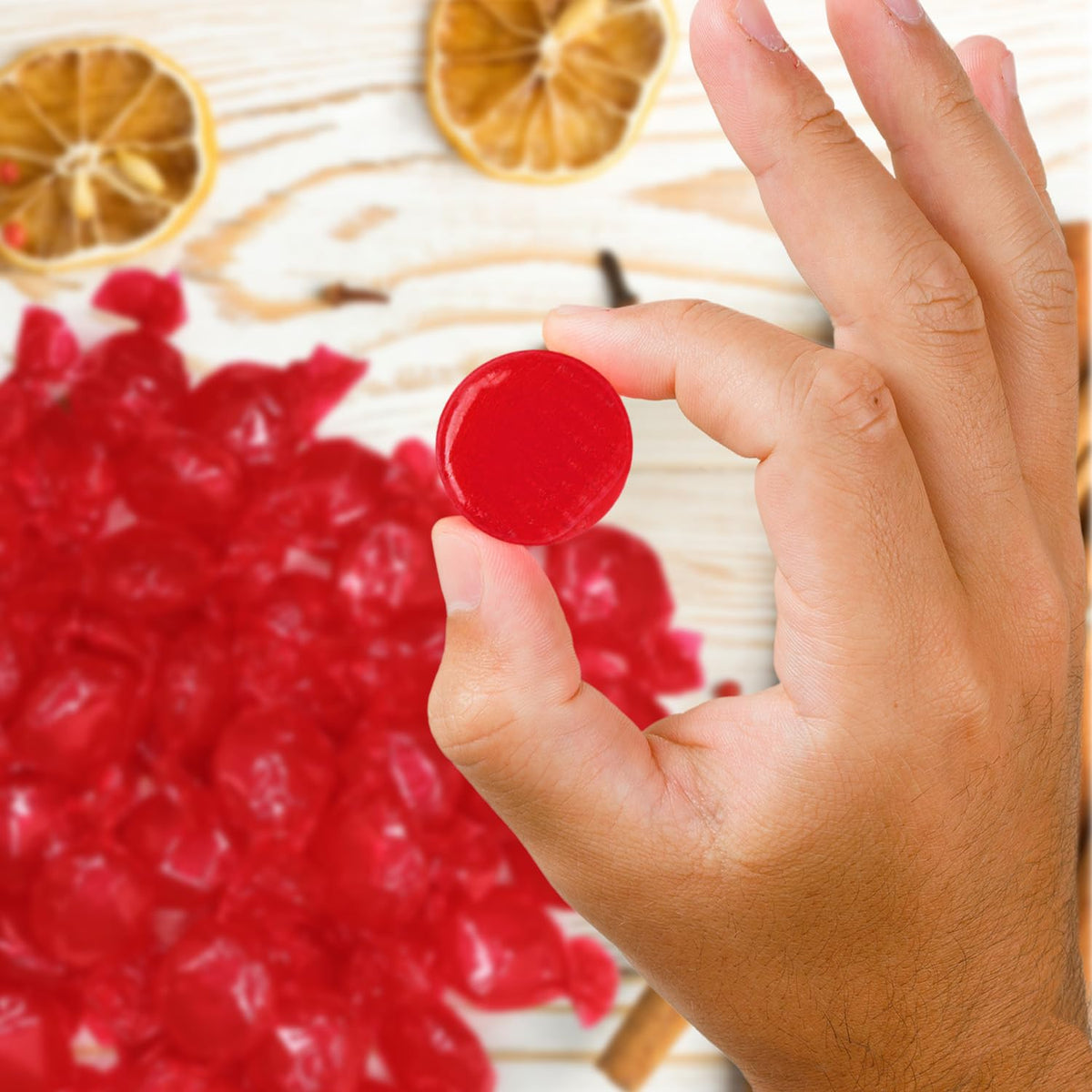 Taboom cinnamon hard candy discs, individually wrapped for hygienic office bowls.