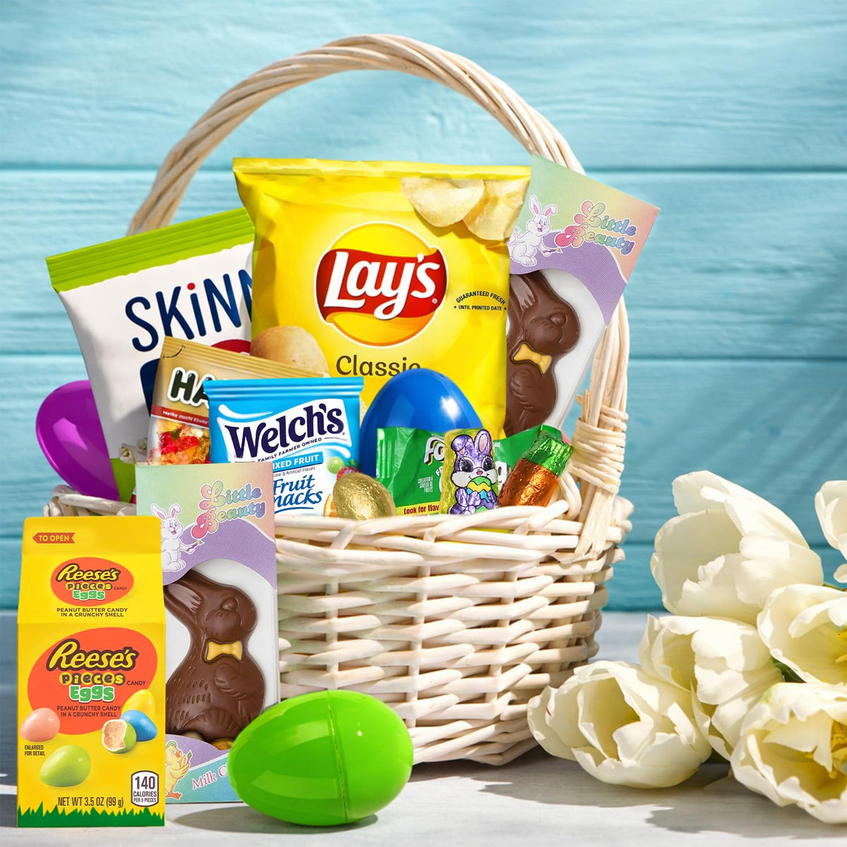 Taboom Easter Snacks Care Package Gift Box displays a variety of candies and treats.