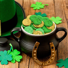Taboom gold and green foil-wrapped coins displayed for party decor