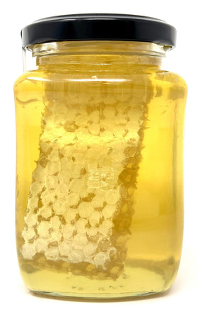 TAJ Gourmet Foods honeycomb closeup shows natural texture and golden aroma for gourmet tasting.