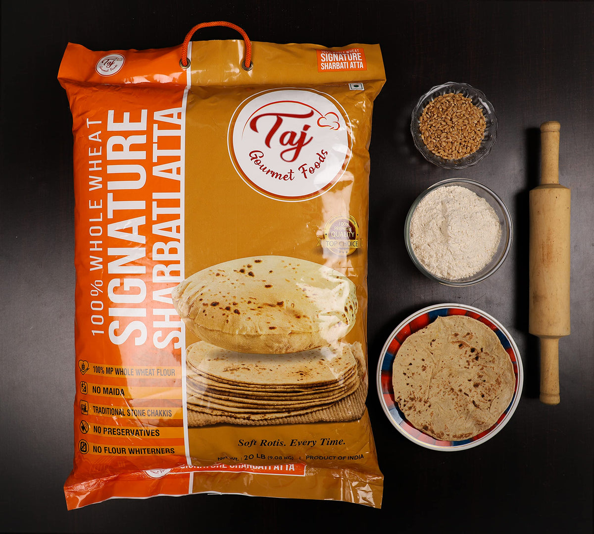 TAJ Sharbati Atta at the chakki mill, emphasizing stone-ground quality and wholesome flour.