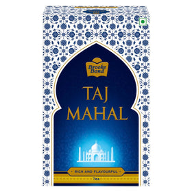 Taj Mahal Tea With Long Leaves 500g canister on shelf for daily black tea ritual.