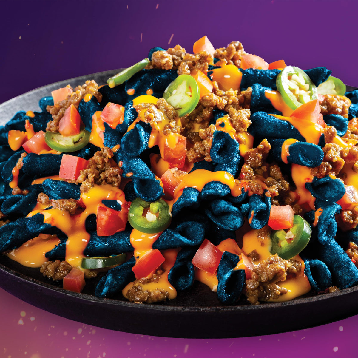 Takis Blue Heat chili-lime seasoning detail hints at bold, zesty taste.