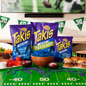 Close-up of Takis Blue Heat chips revealing rolled texture and color
