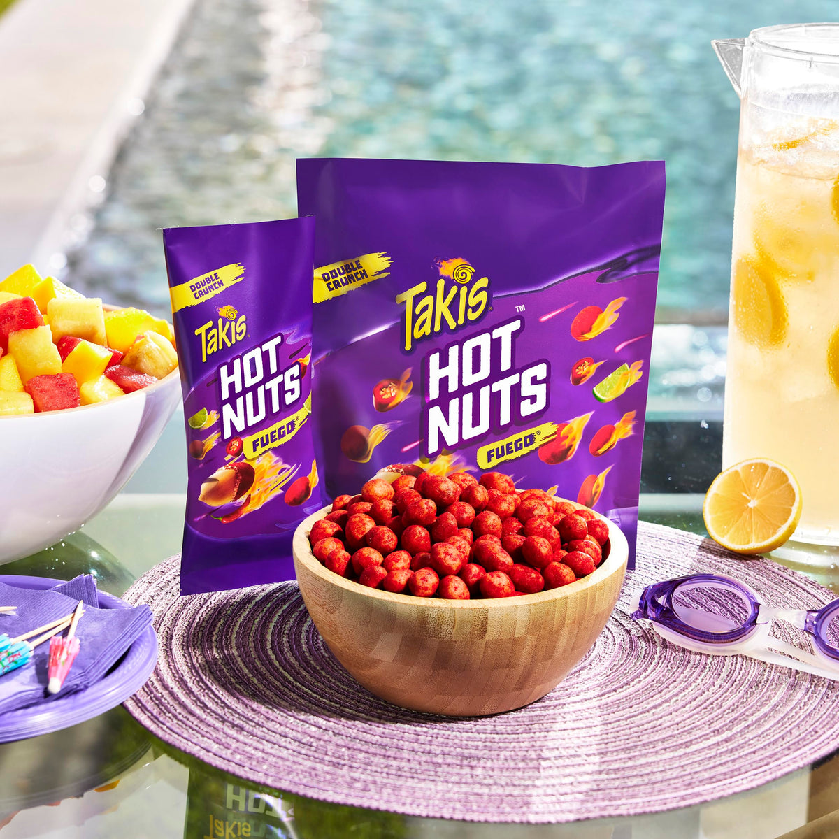 Takis Fuego Hot Nuts pack on table, convenient travel snack for adventures.