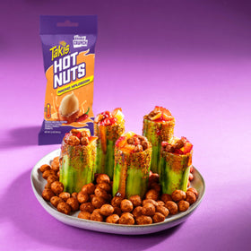 Box and multiple packs of Takis Nacho Xplosion Hot Nuts displayed together.