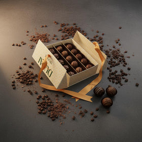 TAMMZEE coconut truffle close-up, creamy coating and aromatic flavor.