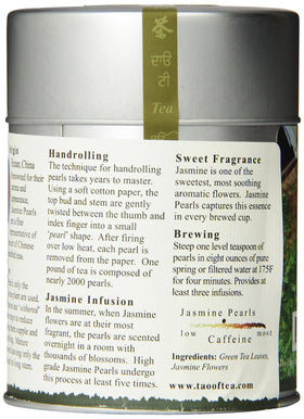 Green tea leaves and jasmine blooms ready to steep with The Tao of Tea.