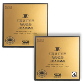 TAOindustry Gold Tea bag in cup with rich aroma and smooth flavor.