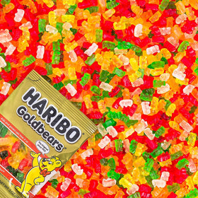 Tasmo Haribo Goldbears orange mini bags arranged as party favors for gatherings.