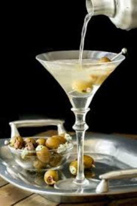 Tassos olives arranged on a charcuterie board for a gourmet appetizer.