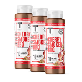 Taste Flavor Co. Cherry Smoked BBQ bottle pouring to enhance grilled meals.