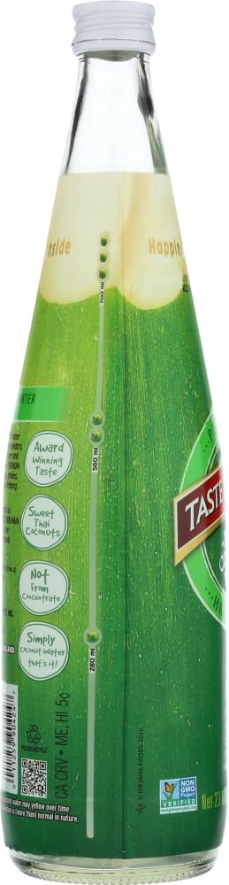 Taste Nirvana coconut water 23.6 oz bottle pour, perfect for on-the-go hydration.