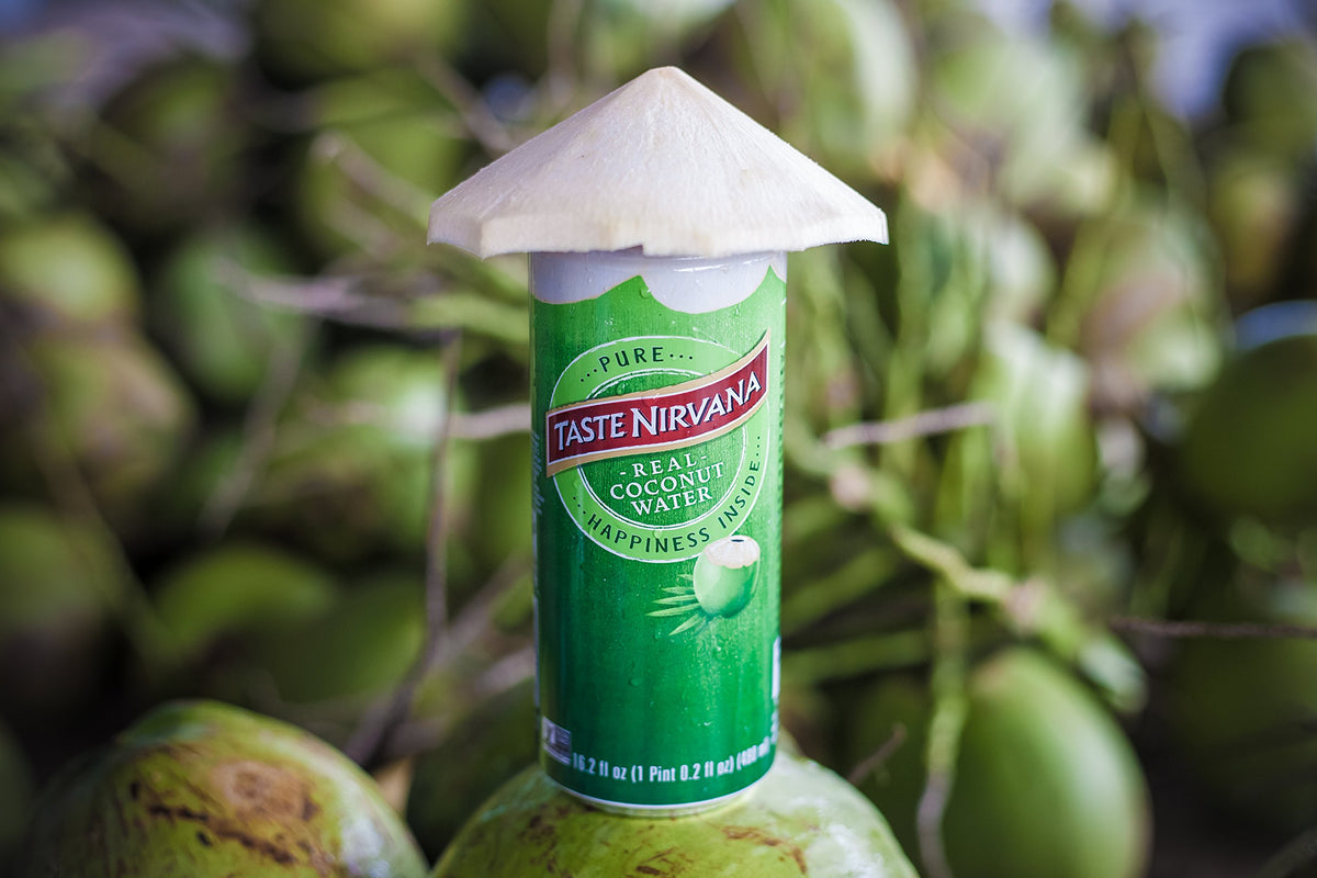 Taste Nirvana coconut water being poured into glass for hydration.