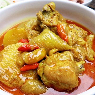TastePadThai Mae Ploy green curry paste jar for vibrant coconut curries.