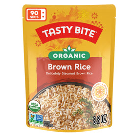 Tasty Bite organic brown rice steaming in a bowl, ready to serve.