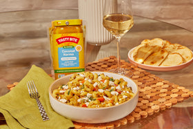 Tasty Bite Spicy Vindaloo sauce pouch adds bold heat.