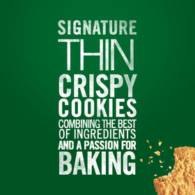 Moist coconut visible inside Tate's Coconut Crisp Cookies bite