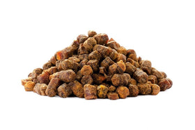 Hands scoop Tavusker bee bread for daily wellness