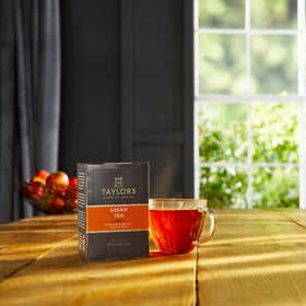 Taylors of Harrogate Assam tea bags steeping cup with bold malty aroma