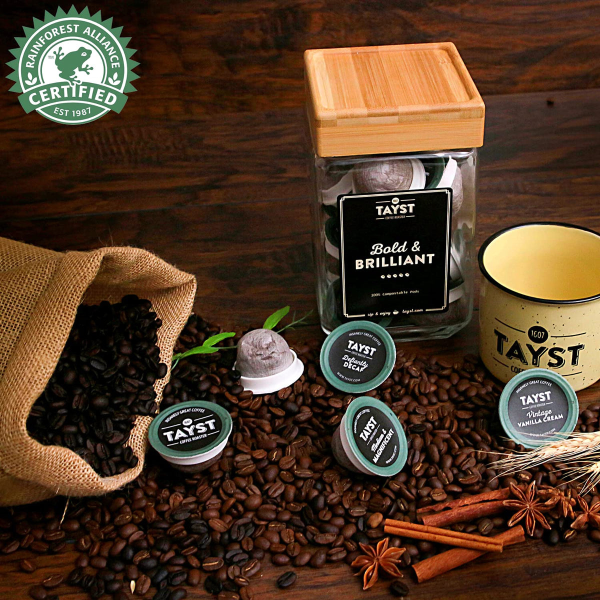 Tayst Rainforest Alliance logo with pods signifying responsible farming