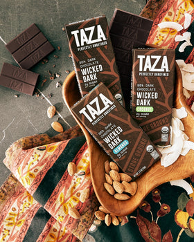 Almonds visible beside the dark chocolate emphasize wholesome snacking.