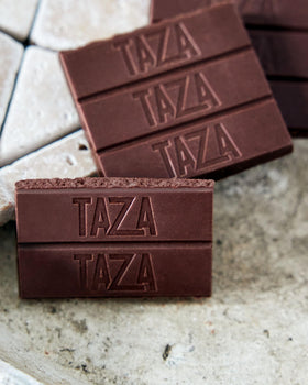 Cracked bar reveals stone-ground texture and crunchy almonds for a satisfying bite.