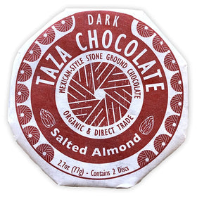 Taza dark chocolate disc with grain-mill texture—artisanal Mexican-style bite