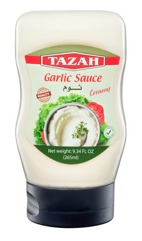 Tazah Lebanese Garlic Sauce bottle pouring, showcasing creamy toum flavor for shawarma.