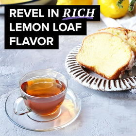 Single TAZO Glazed Lemon Loaf tea bag steeping in hot water releases lemon and vanilla flavors.