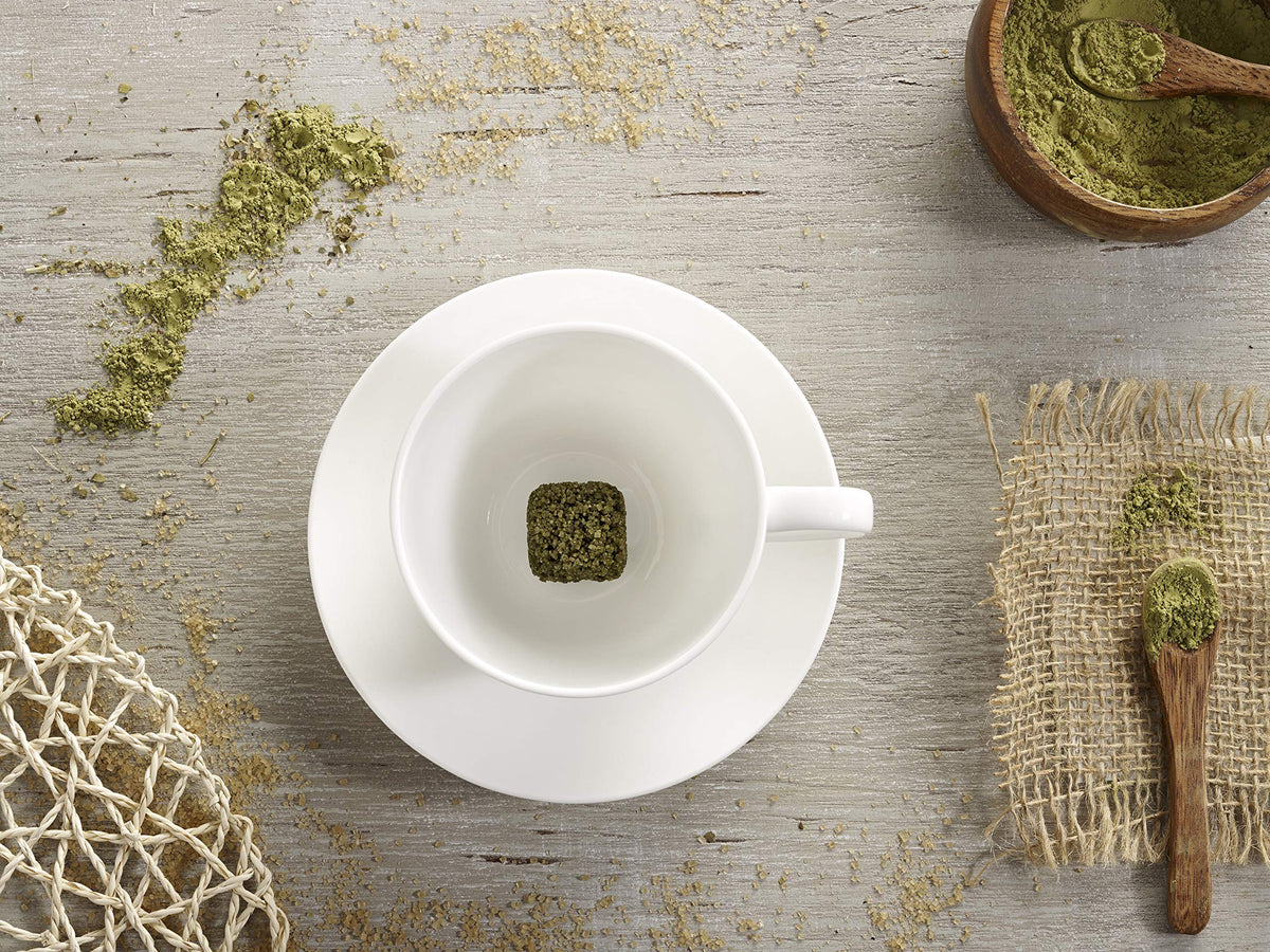 Tea Drops Matcha Green Organic dissolving in hot water for a quick cup.
