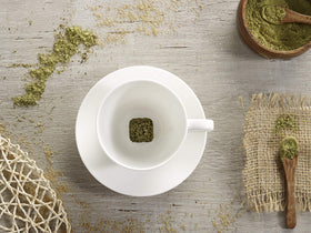 Tea Drops Matcha Green Organic dissolving in hot water for a quick cup.