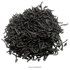 Tea Forte loose-leaf tea leaves ready to measure for precise brewing.