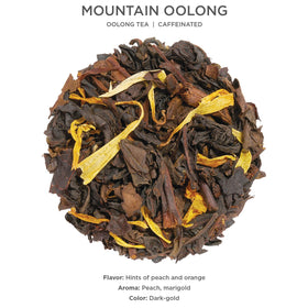 Tea Forte Mountain Oolong loose tea leaves photographed in a scoop ready for infusion