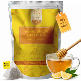 Tea Leaf & Co. honey-lemon green tea bags in packaging, ready for brewing.