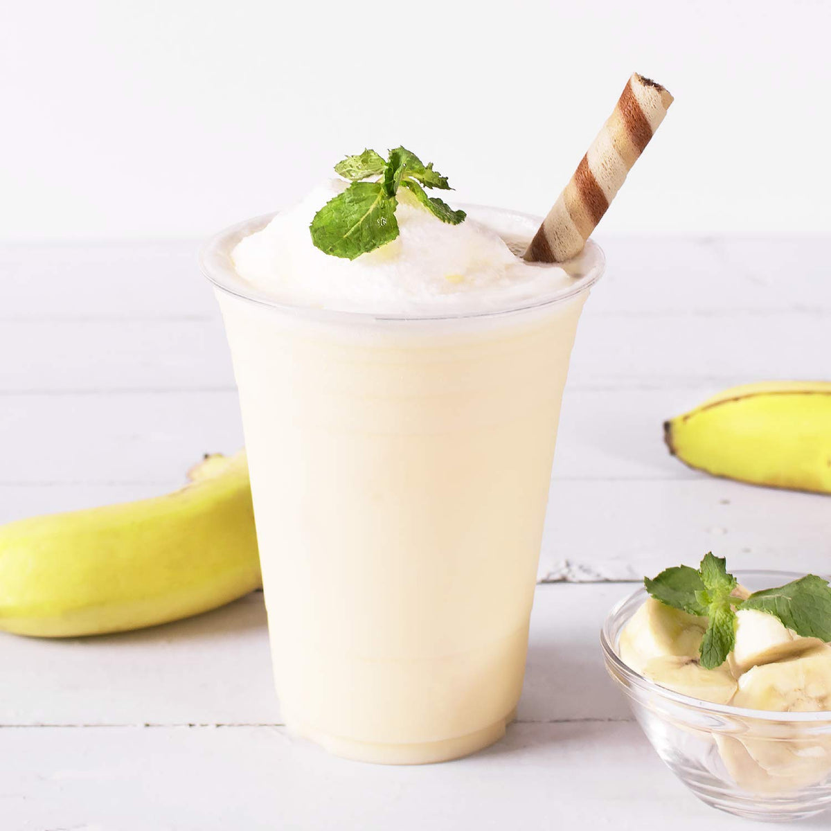 Measuring scoop with Tea Zone banana powder for precise portions.