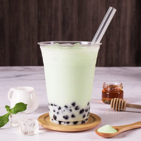 Tea Zone Honeydew Powder bottle scene highlights easy pouring and beverage versatility.
