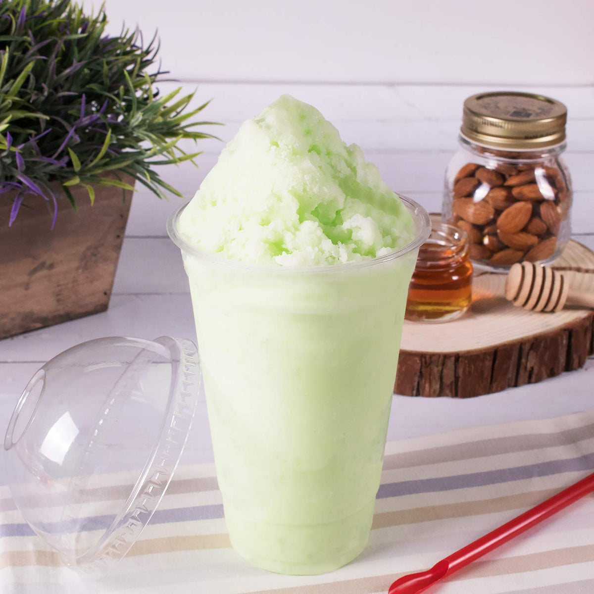 Tea Zone Honeydew Powder smoothie glass highlights vibrant color and creamy texture.