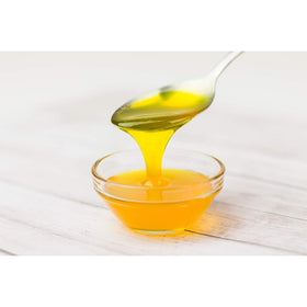 Tea Zone Mango Syrup used as a dessert topping on ice cream